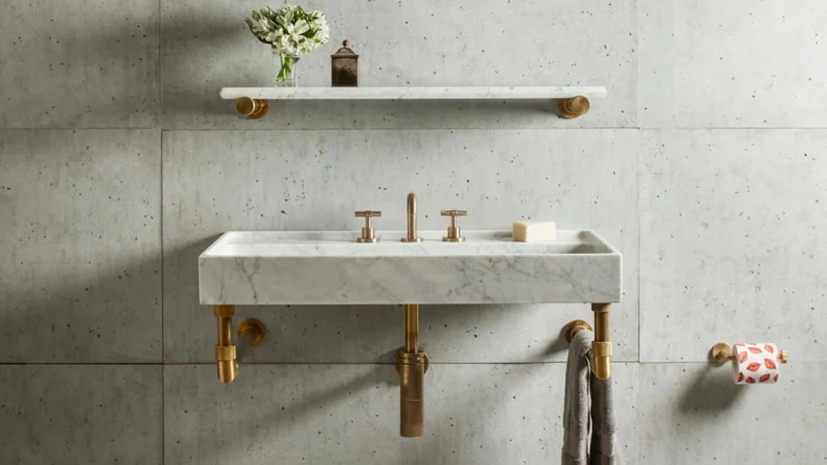 Wall-Mount Sink Plumbing Design Guide Wall-mounted bathroom sink with exposed drain assembly and supply lines illustrating typical wall-mount sink plumbing design.