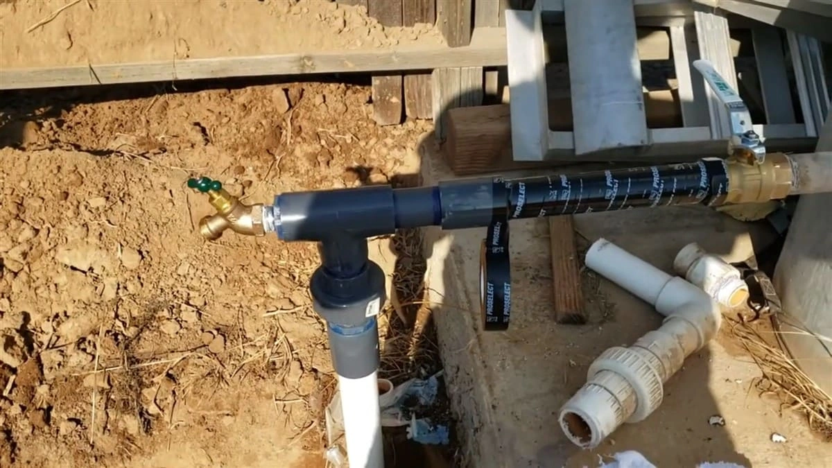New shutoff valve and repaired water main line installed during residential water main repair in Clovis, CA