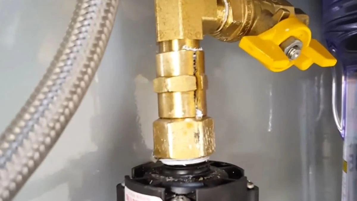 Split brass water supply fitting leaking during plumbing inspection of a coffee cart in Clovis, CA.